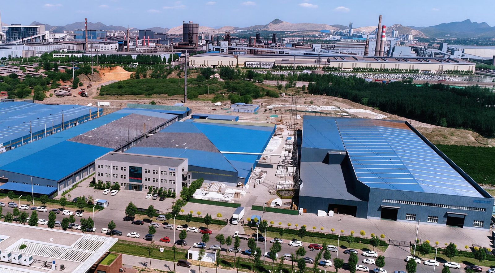 Aerial view of the TAITAO manufacturing campus showing the size of the kiln and drying halls relative to the rest of the plant